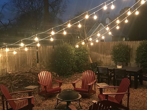 Outdoor garden with firepit and dining area