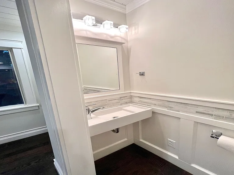 Main floor includes a charming, nicely appointed guest bath