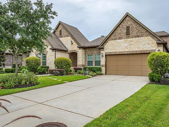 Gorgeous 1.5 story David Weekley home located on the 18th hole of the Golf Club of Houston course.