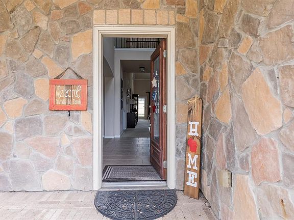 There is a covered front porch and you will enter through a leaded glass front door.
