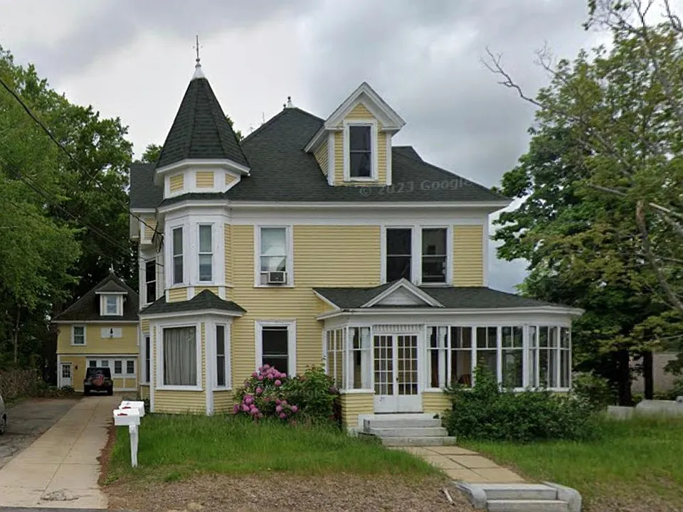 Main house, community sun porch overlooking main st and historic church.