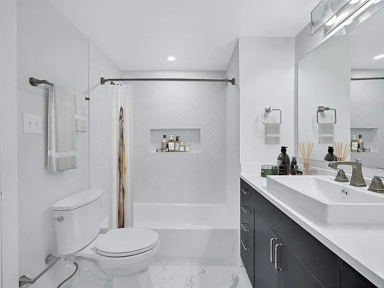 Spa inspired bathrooms with tiled shower and custom vanity