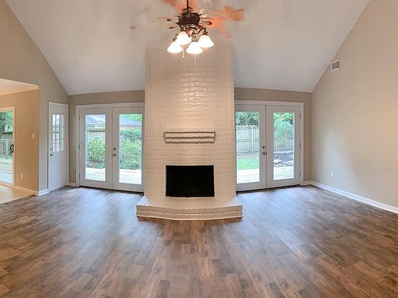 View of full living space/formal dining room. Very large open area.