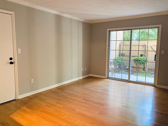 Hardwood floors on living room, fresh paint.