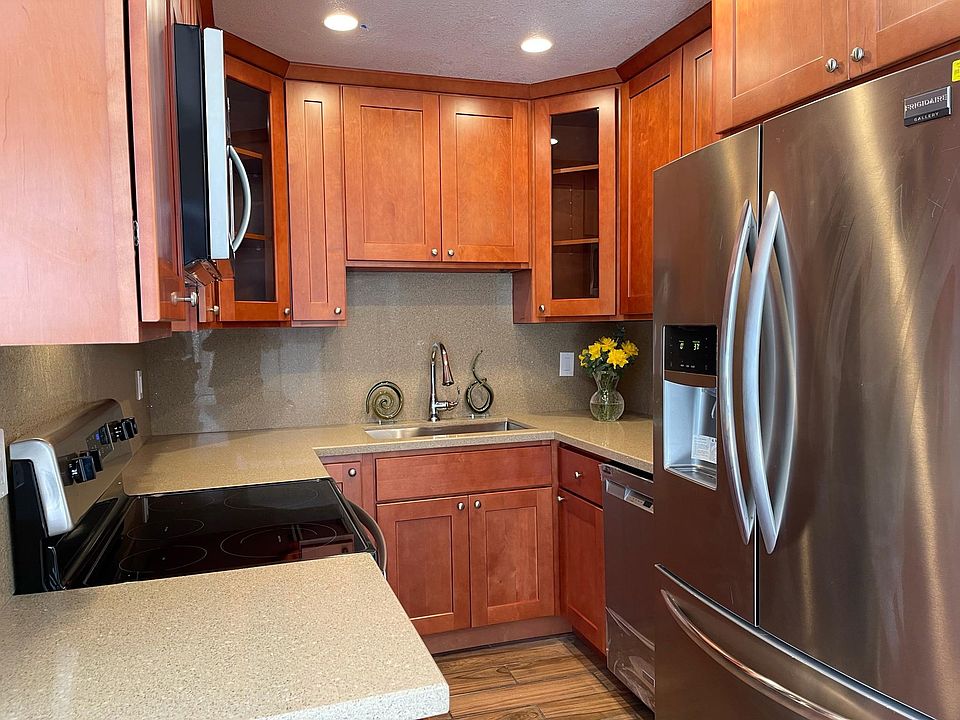 All new kitchen; cabinets, counter top, sink & faucet, appliances and tiled floor.