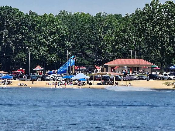 "Main Beach" is a communal area in the Lake. Swimming Pool, pavilions and lake swim area. 
Lake offers marina's with loading areas for boats and watercrafts (motorized and non). 
Basketball and tennis courts, as well as playgrounds throughout neighborhood
