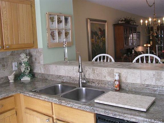 Kitchen with custom tile wo...
