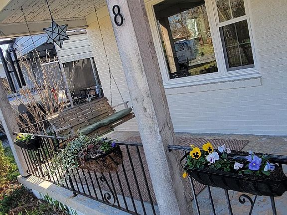 The swing is already hanging on the front porch.