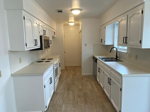 Kitchen now has new black and stainless oven/stove.