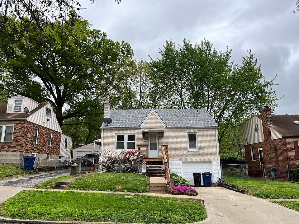 Front of house. Garage door has been removed and is now a walk-out basement