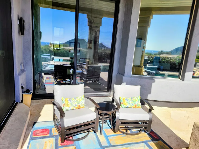 Just off the primary suite, these swivel rockers are perfect for morning coffee and sundowners