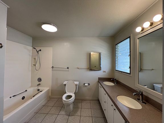 Primary suite private bath with double sinks