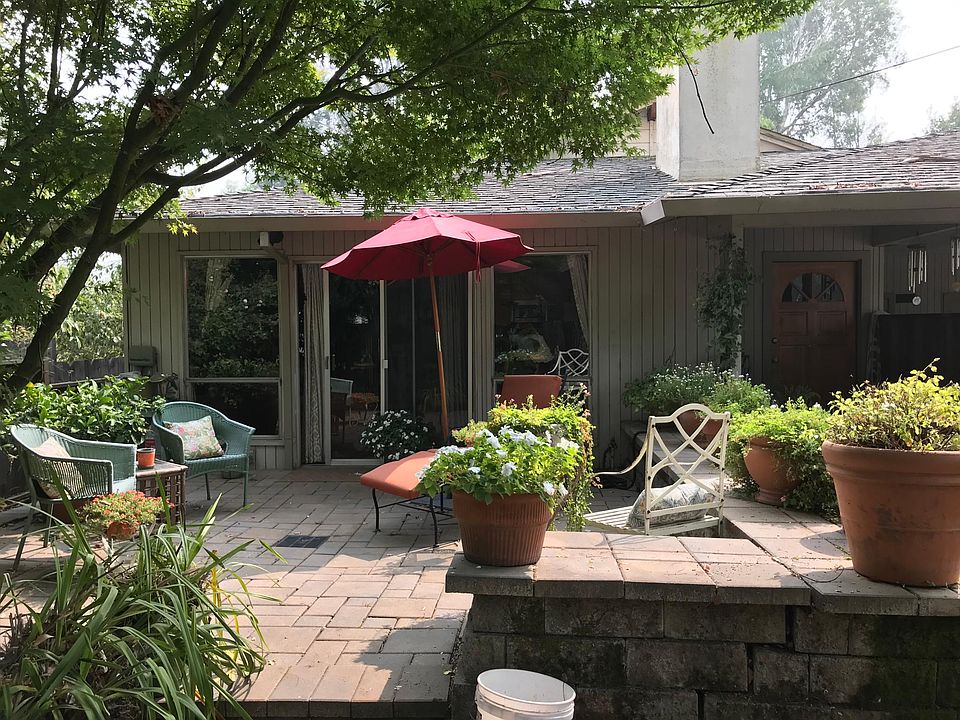 Private, fenced and raised patio with shade and some plantings. Previous tenant's plantings and furniture shown here.