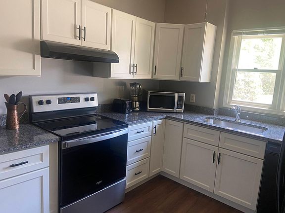 Renovated kitchen with new cabinets, sink and granite countertops