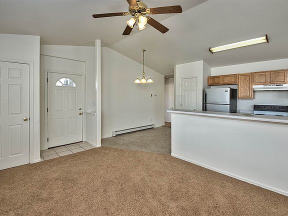 A separate dining area is paired to a spacious breakfast bar in this cute and cl