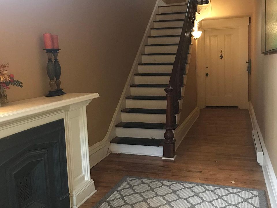 Building entryway and stairs leading to apartment 3