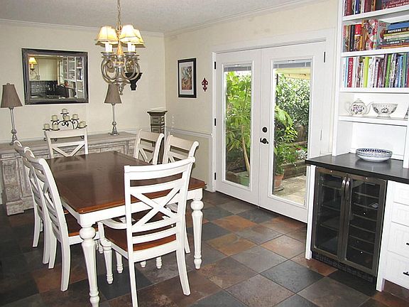 DINING ROOM WITH FRENCH DOORS LEADING TO COVERED PATIO