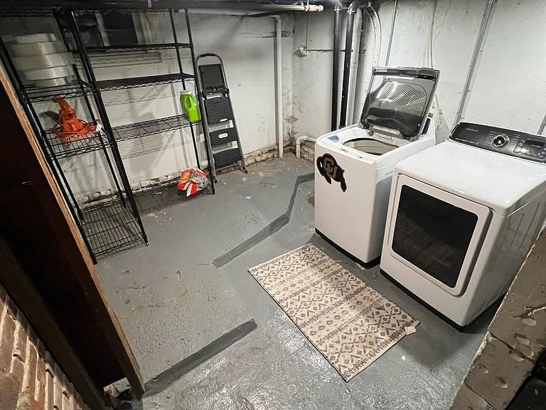 The basement has a Samsung washer and dryer and plenty of storage space. Two storage racks (pictured) included.