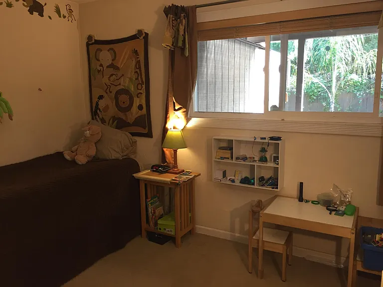 Bedroom number 2 adjacent to master. Uses hallway bathroom. Large closet (not shown on photo). Beautiful view of private back yard.