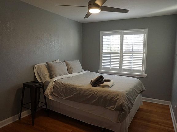 Front bedroom, both have matching ceiling fans and blinds