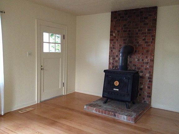 Living room with a wood burning stove for emergencies when the power fails.