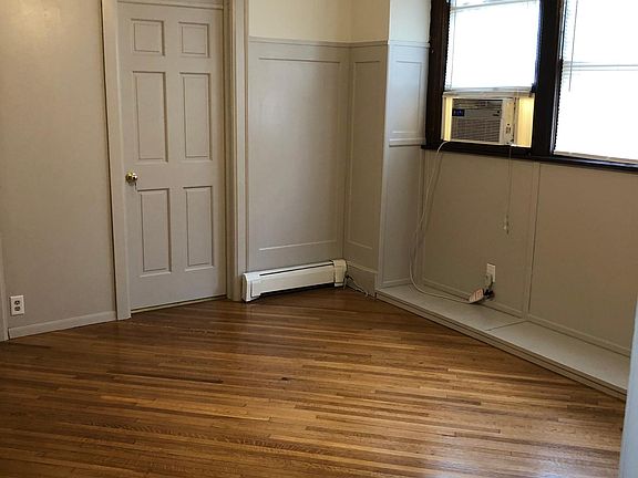 First floor living room with newly refinished wood floor