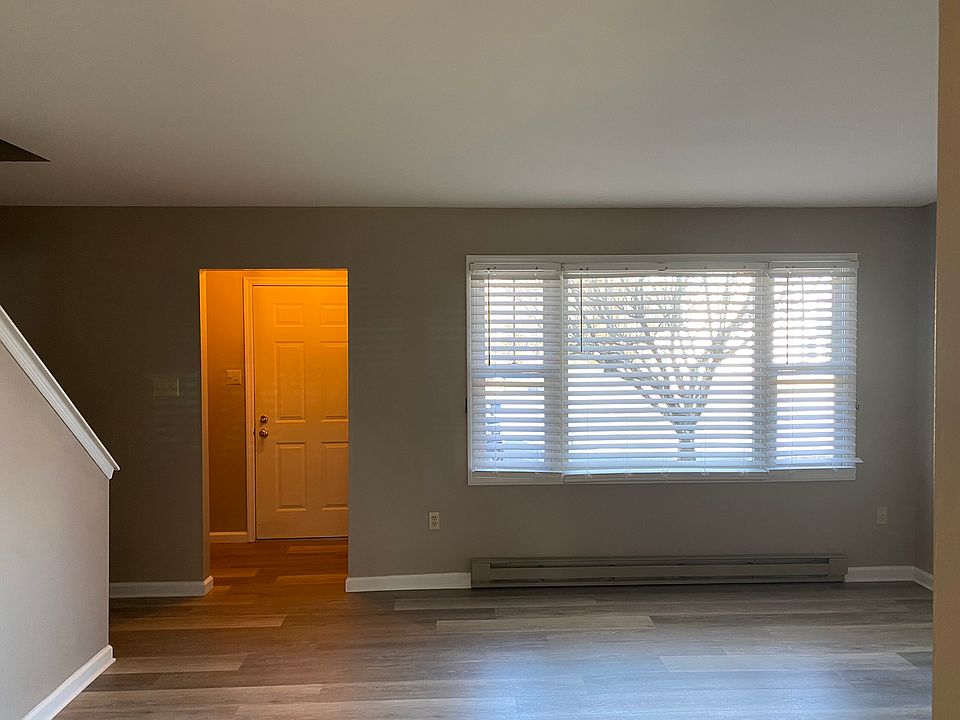 Spacious Living room with attractive window treatment