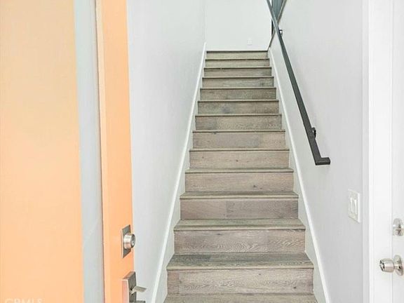 Front door entry. Main kitchen/living level is upstairs from the garage/street level.