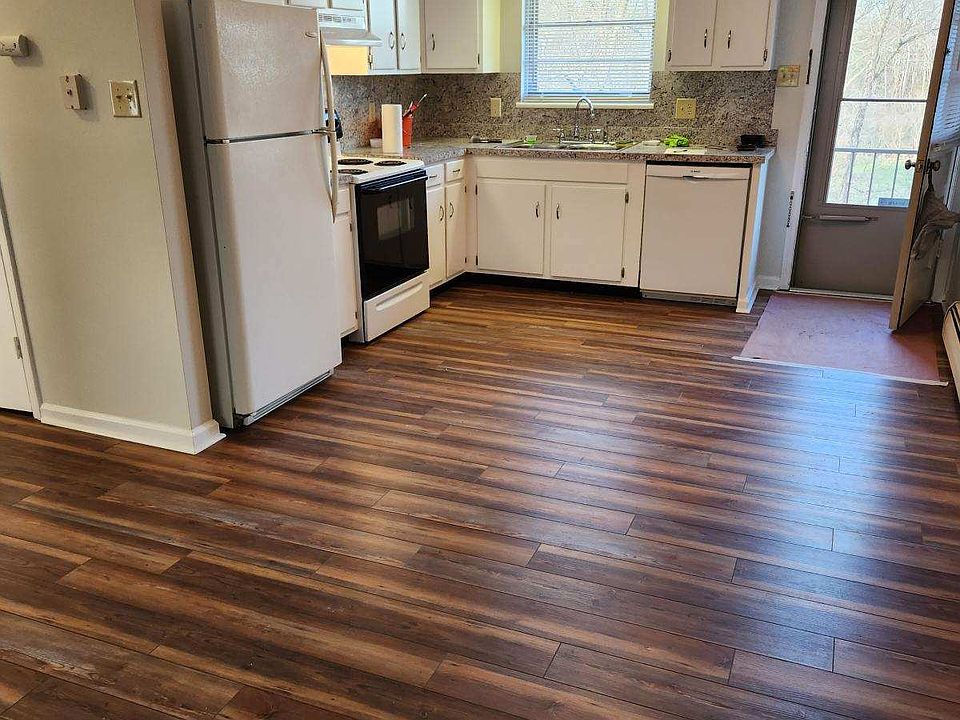Full eat in kitchen with dishwasher & a large adjacent laundry room providing additional storage.