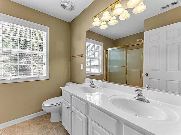 Upstairs full bath with tub and overhead shower