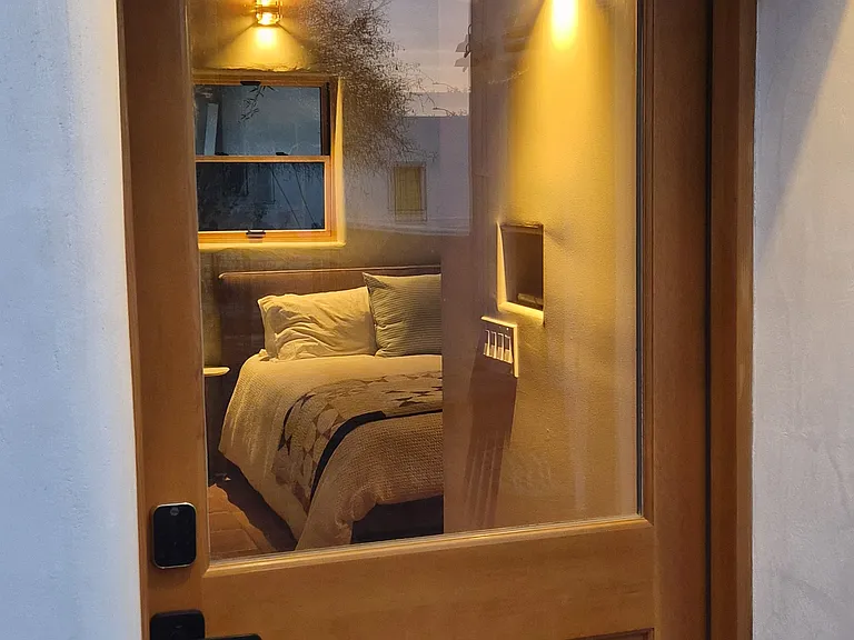 entry door and thick adobe walls