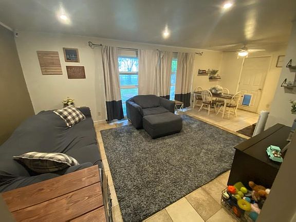Living room with furniture and curtains