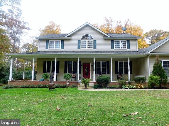 The porch is concrete with a brick edging