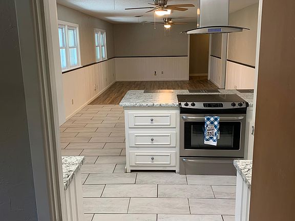 enjoy visiting with your friends if you split up the cooking with whoever will help you. _______ all the exhaust is done through a ceiling mount exhaust fan, the stove stays, as well as the dishwasher. sink faucet turns on with a wave of your hand!