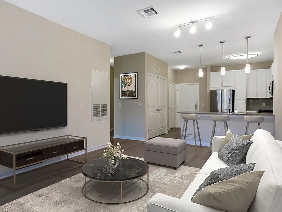 Renovated Package II kitchen, dining, and living areas with hard surface flooring