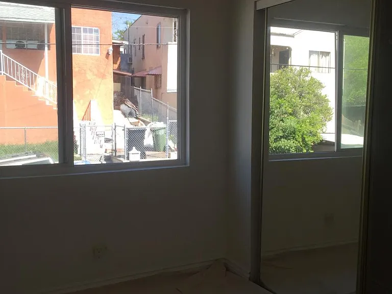 Second bedroom, mirrored closet doors
