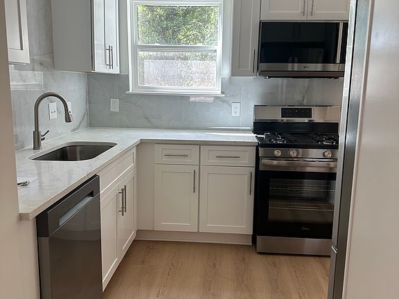 Fully renovated kitchen with modern upgrades.
