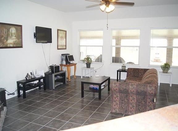 Tile floors through living areas. Large living room w/ fireplace