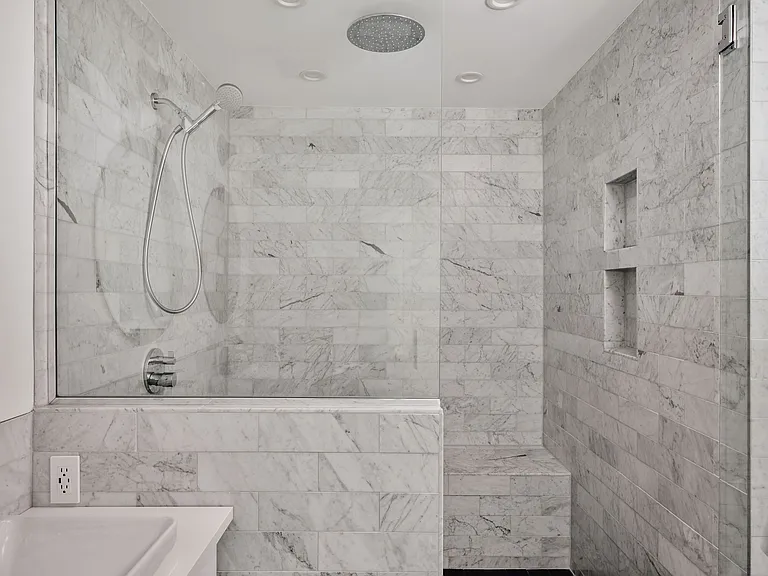 Primary bedroom walk-in spa-like shower experience.
