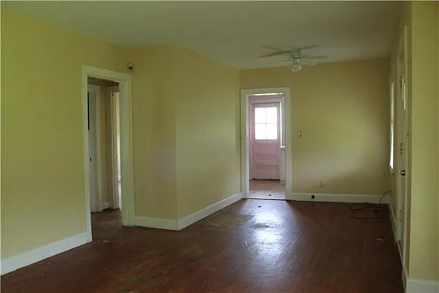 View from Living room towards Kitchen prior to floor refinishing.