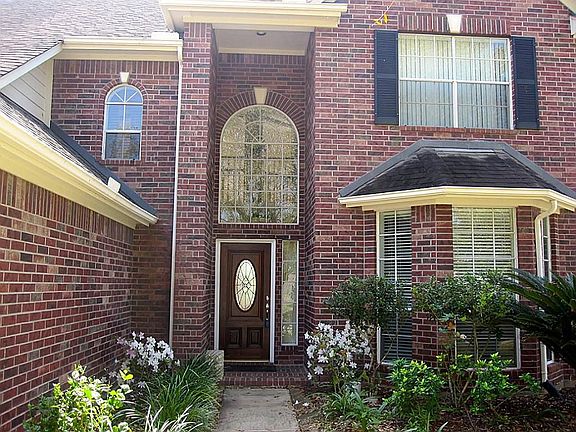 Beautiful landscaping greets you as you enter the home.