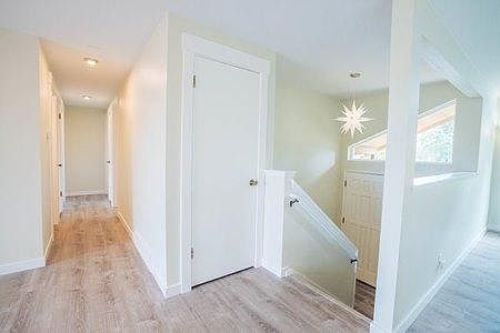 Main and front hall. Stairs to garage and laundry