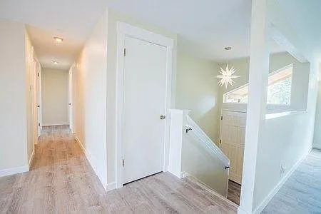 Main and front hall. Stairs to garage and laundry