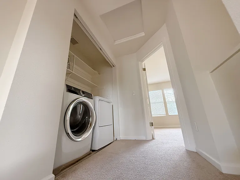 Laundry on bedroom floor