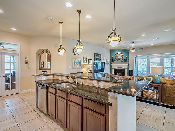Plenty of additional space & great lighting at the island, with extra Dining area adjoining Family room.