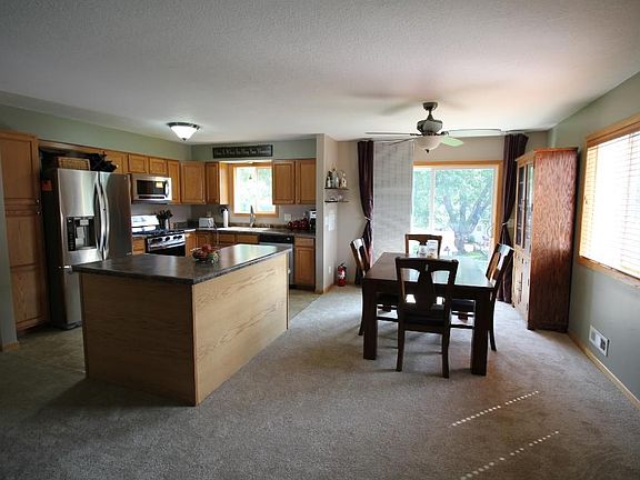 Living Room, Kitchen, and Dining Room flow together in an abundance of space throughout the main level.