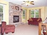 Living room with stone fireplace