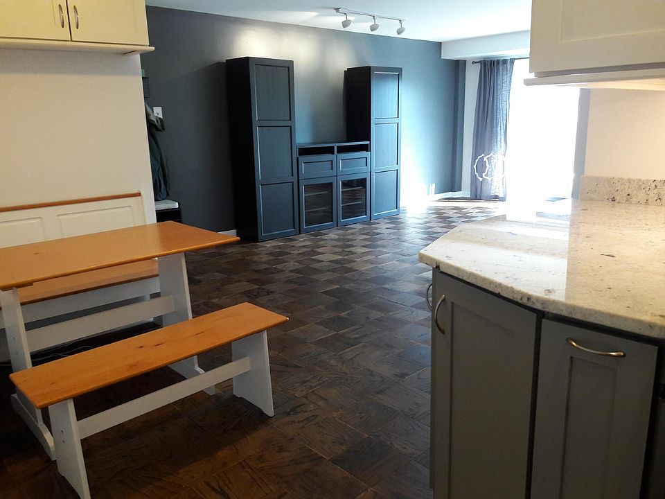 View from kitchen entrance into dining nook and living room