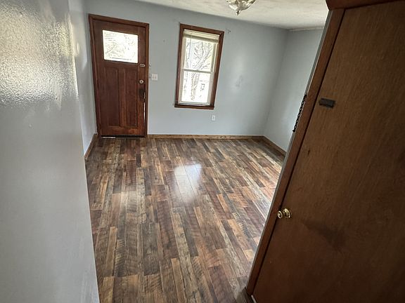 Living Room from Kitchen, door is to the shared basement/laundry area