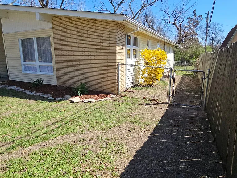 Side yard is fenced, making a smaller play area.